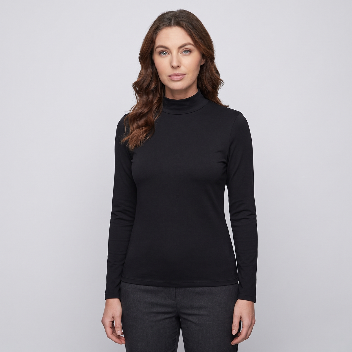 Woman wearing the black women's thermal top, front view